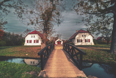 Pier over lake against sky