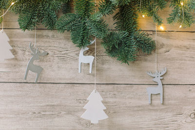 Christmas decorations hanging on tree