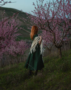 Young woman standing on field