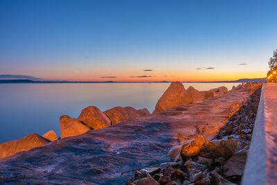 Scenic view of sea against sky at sunset