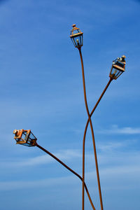 Curving street lanterns on the quai de la perle in dinard, brittany