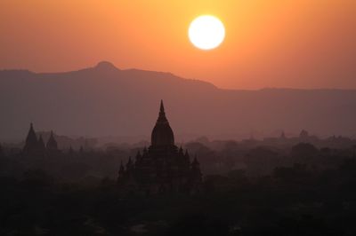 Historic temple against clear sky at sunset