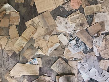 High angle view of papers on hardwood floor