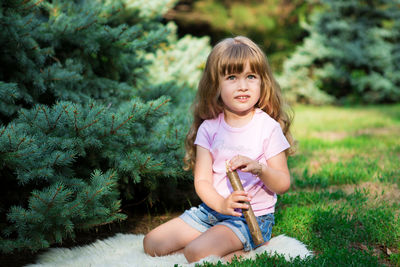 Portrait of a girl sitting on grass