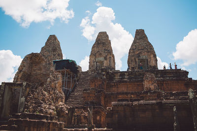 Low angle view of old temple against sky