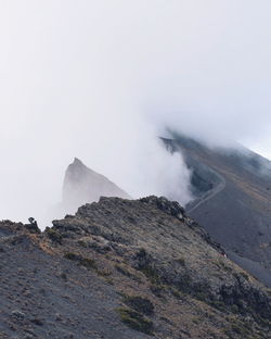 Scenic view of volcanic mountain against sky