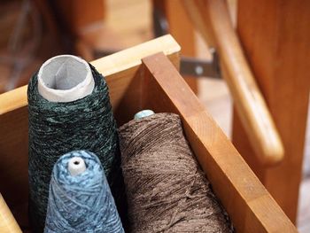 Close-up of string spools in drawer