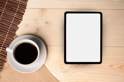 Directly above shot of coffee cup on table