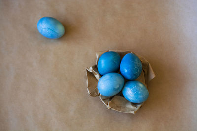 High angle view of multi colored eggs on table