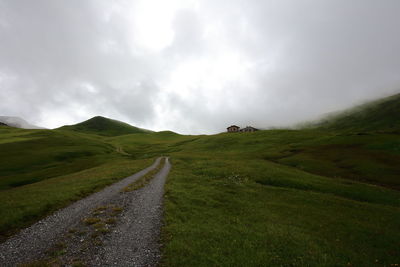 Country road along grassy landscape