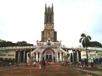 Tourists in front of building