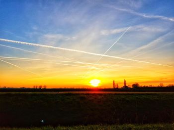 Scenic view of landscape against sky during sunset