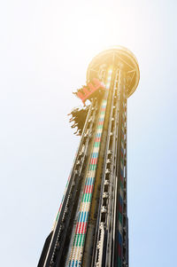 Low angle view of ferris wheel against sky