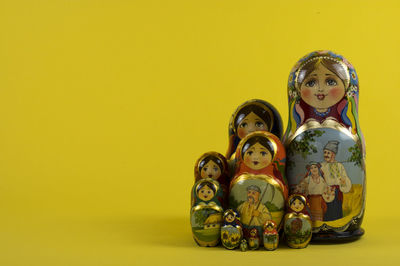 View of figurine against yellow background
