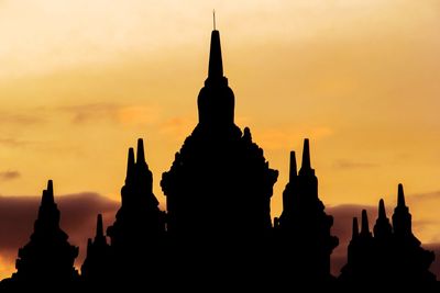 Silhouette of temple against sky during sunset