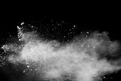 Firework display over black background