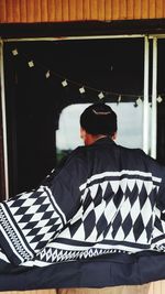Rear view of men wear kimono at home