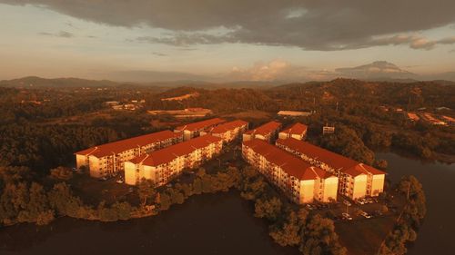 High angle view of buildings against sky at sunset