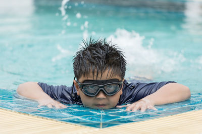 Young woman swimming in pool