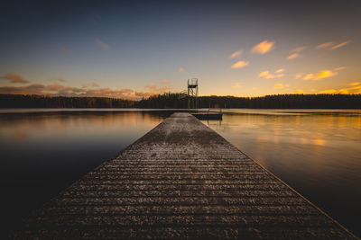 Scenic view of lake at sunset