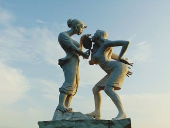 Low angle view of statue against sky