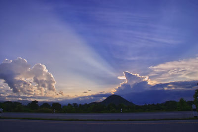 Scenic view of field against sky at sunset