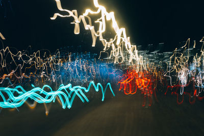 Low angle view of light trails at night