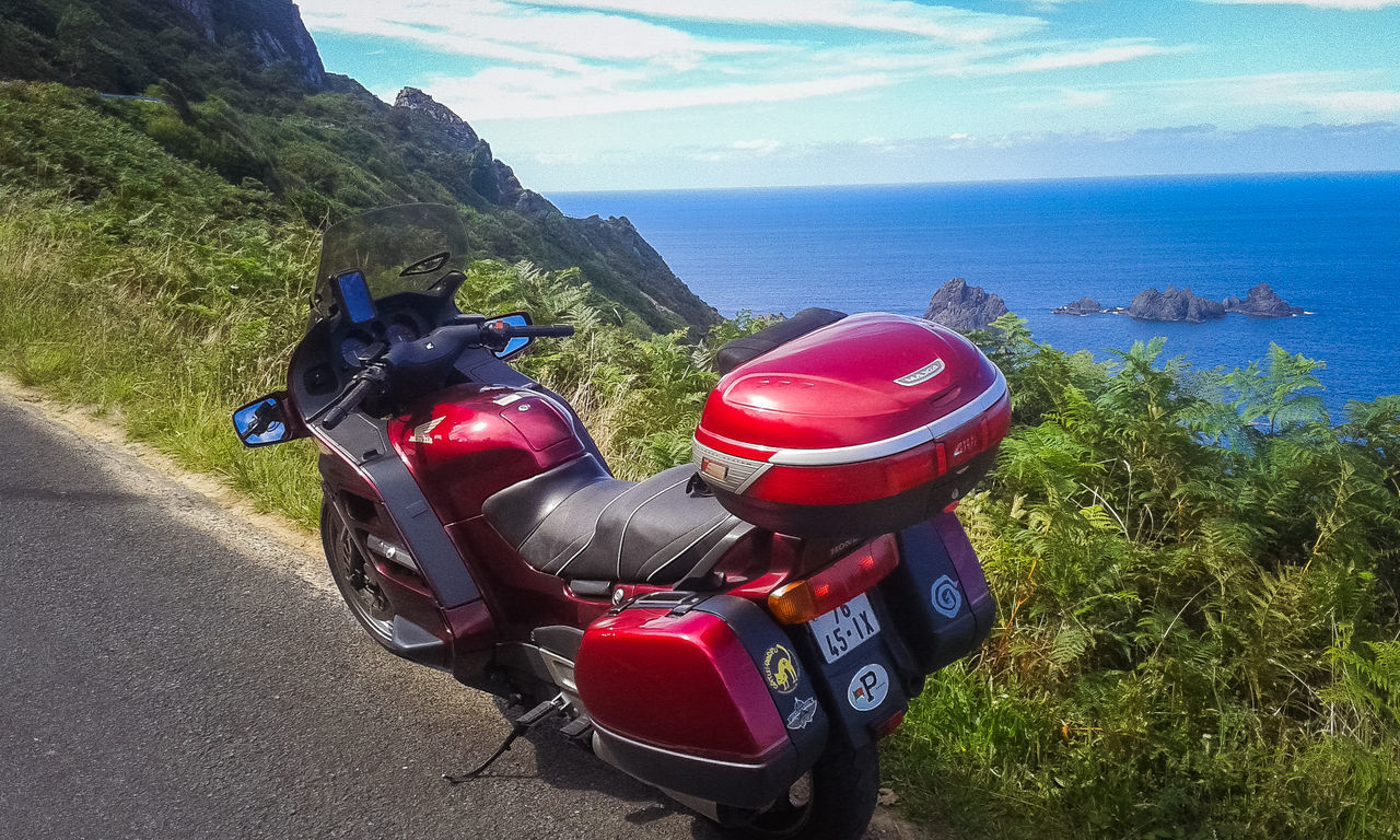 RED ROAD BY SEA AGAINST SKY