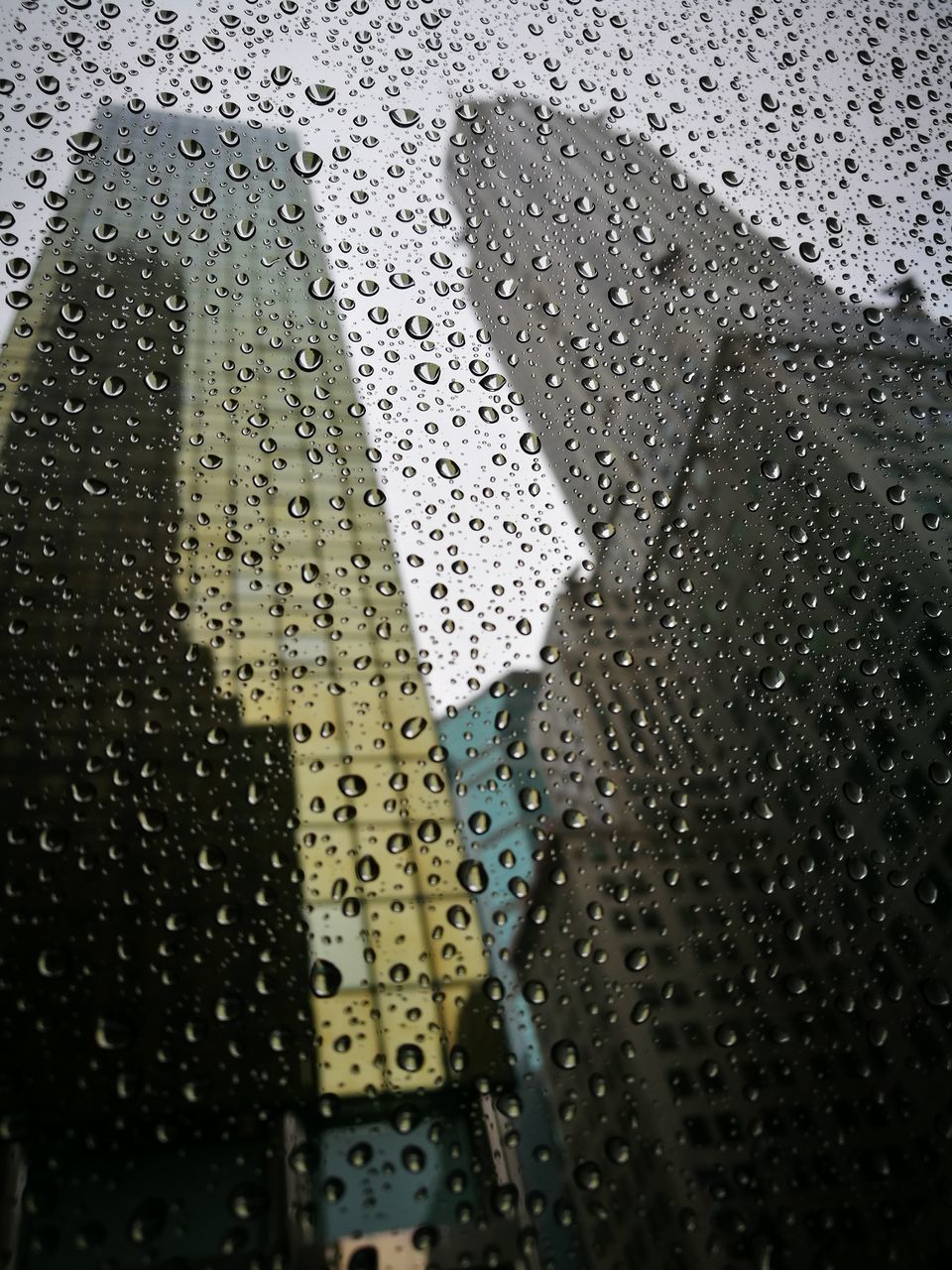 RAINDROPS ON GLASS WINDOW