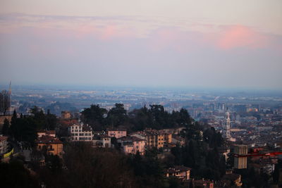 High angle shot of townscape against sky at sunset