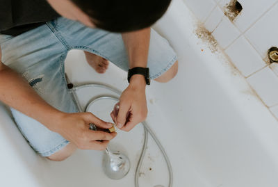 High angle view of woman washing hands