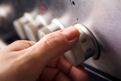 Close-up of hand holding camera