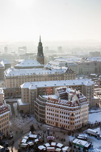 High angle view of buildings in city during winter