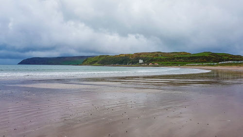 Scenic view of beach against sky