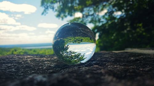 Close-up of crystal ball on field