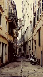 Narrow alley with buildings in background