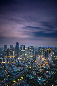 Illuminated cityscape against sky