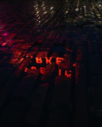 Full frame shot of illuminated text at night