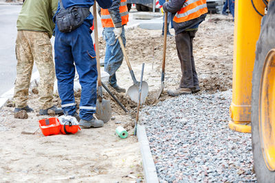 Low section of people working at construction site