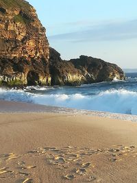 Scenic view of beach against sky