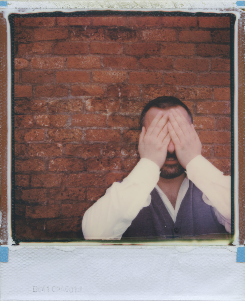 PORTRAIT OF PERSON ON WALL AGAINST BRICK WALLS