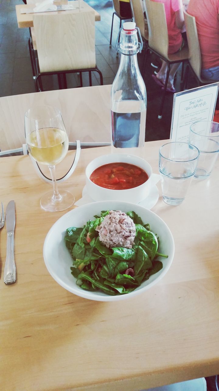 indoors, table, food and drink, still life, freshness, food, drink, drinking glass, high angle view, plate, fork, restaurant, healthy eating, refreshment, spoon, bowl, ready-to-eat, wineglass, wood - material, variation