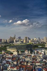 High angle view of buildings in city against sky