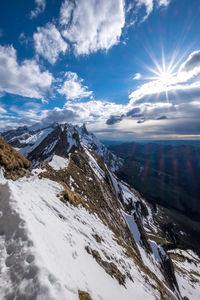 Scenic view of snowcapped mountains against sky