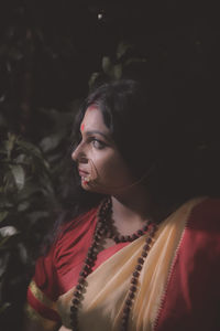 Portrait of young woman looking away