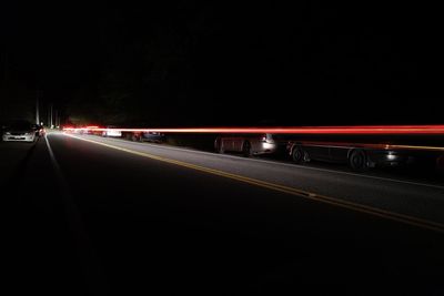 Light trails on road at night
