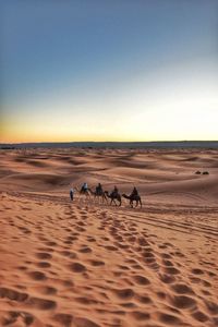 Scenic view of desert against clear sky