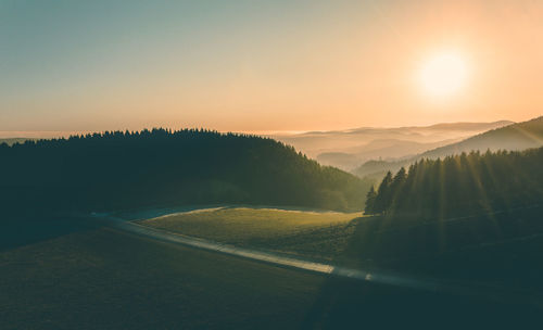 Scenic view of landscape against sky during sunset