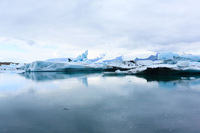 Scenic view of frozen lake against sky