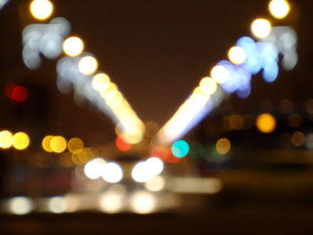 Defocused image of street lights in city at night